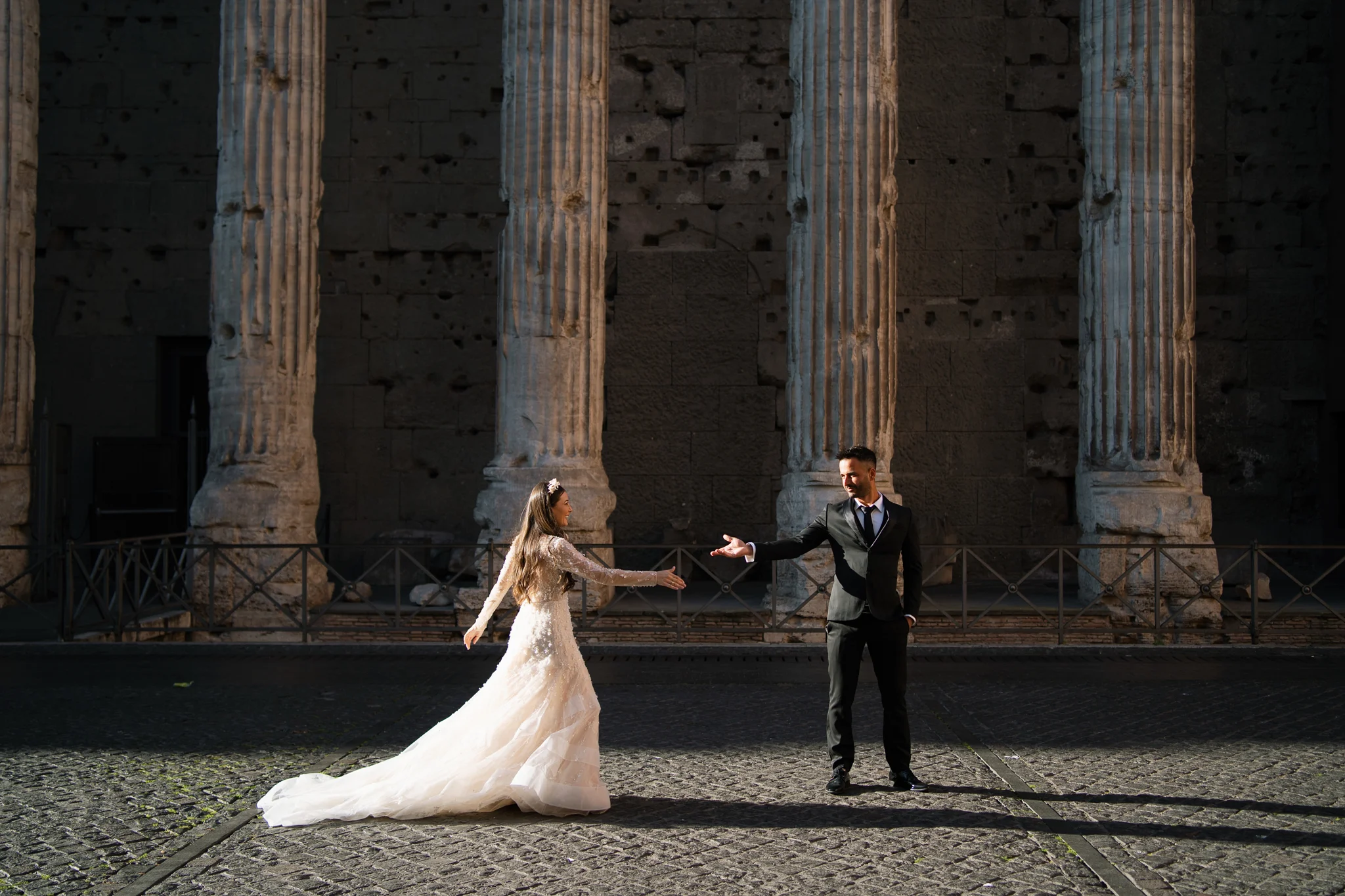 Capturing a dramatic pose with ancient ruins should be on every Italy wedding photo checklist.
